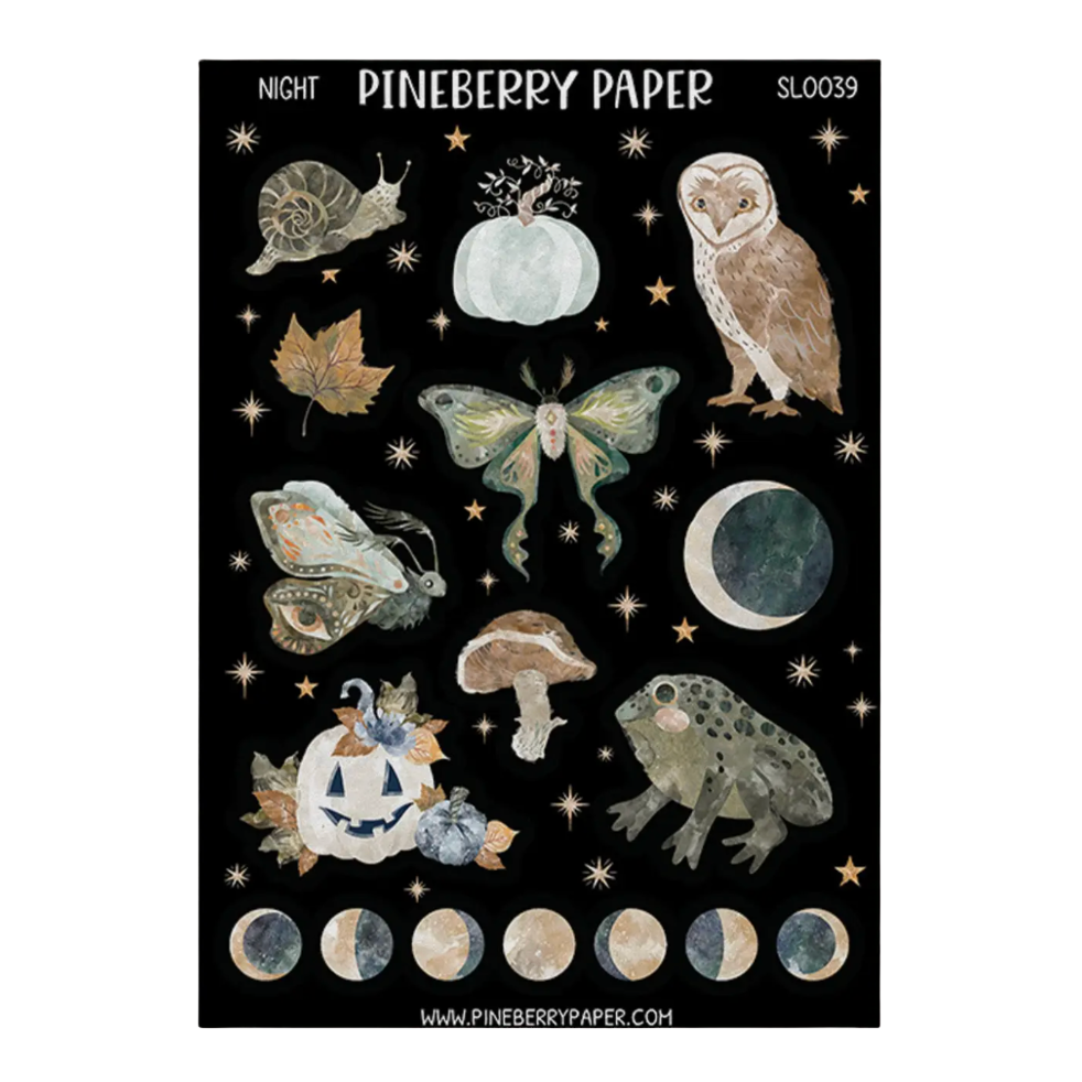 A sheet of Pineberry Paper stickers featuring autumn and celestial designs on a black background. The designs include a snail, pumpkin, owl, butterfly, moon, mushroom, frog, jack-o'-lantern, stars, and moon phases.