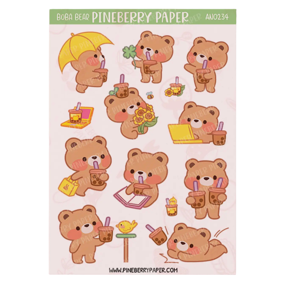 A sheet of cute cartoon bear stickers on a pale pink background, with a green header reading BCBJ BEAR PINEBERRY PAPER and the code AOJ234. The bears are tan and wear pink and yellow accessories, including drinks, flowers, and a yellow umbrella.