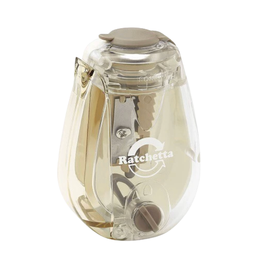 A Ratchetta brand electric pencil sharpener in a clear plastic body with a beige top button and internal metallic sharpening mechanism, shown on a plain white background.