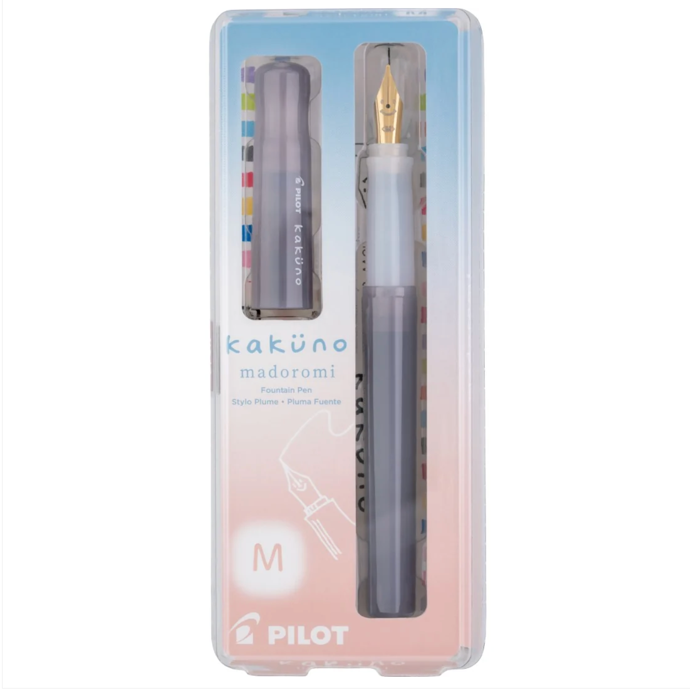 Pilot Kakuno Madoromi fountain pen set in a clear plastic case with a pastel blue and pink background. The set includes a translucent gray pen with a gold nib and a matching ink cartridge.