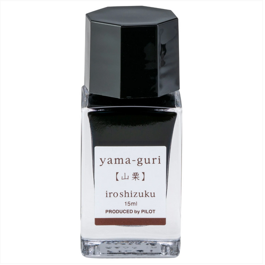 A 15ml bottle of Yama Guri Iroshizuku ink by Pilot, featuring a black cap, a clear glass body showing the dark ink inside, and a white label with brown text.