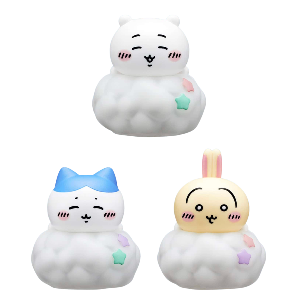 Three cute cloud-shaped character figurines on a plain white background: a white bear with pink cheeks and a mint star, a white cat with a blue bow and purple star, and a pale yellow bunny with pink ears and pastel stars.