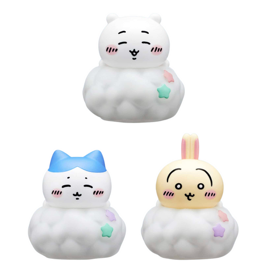 Three cute cloud-shaped character figurines on a plain white background: a white bear with pink cheeks and a mint star, a white cat with a blue bow and purple star, and a pale yellow bunny with pink ears and pastel stars.