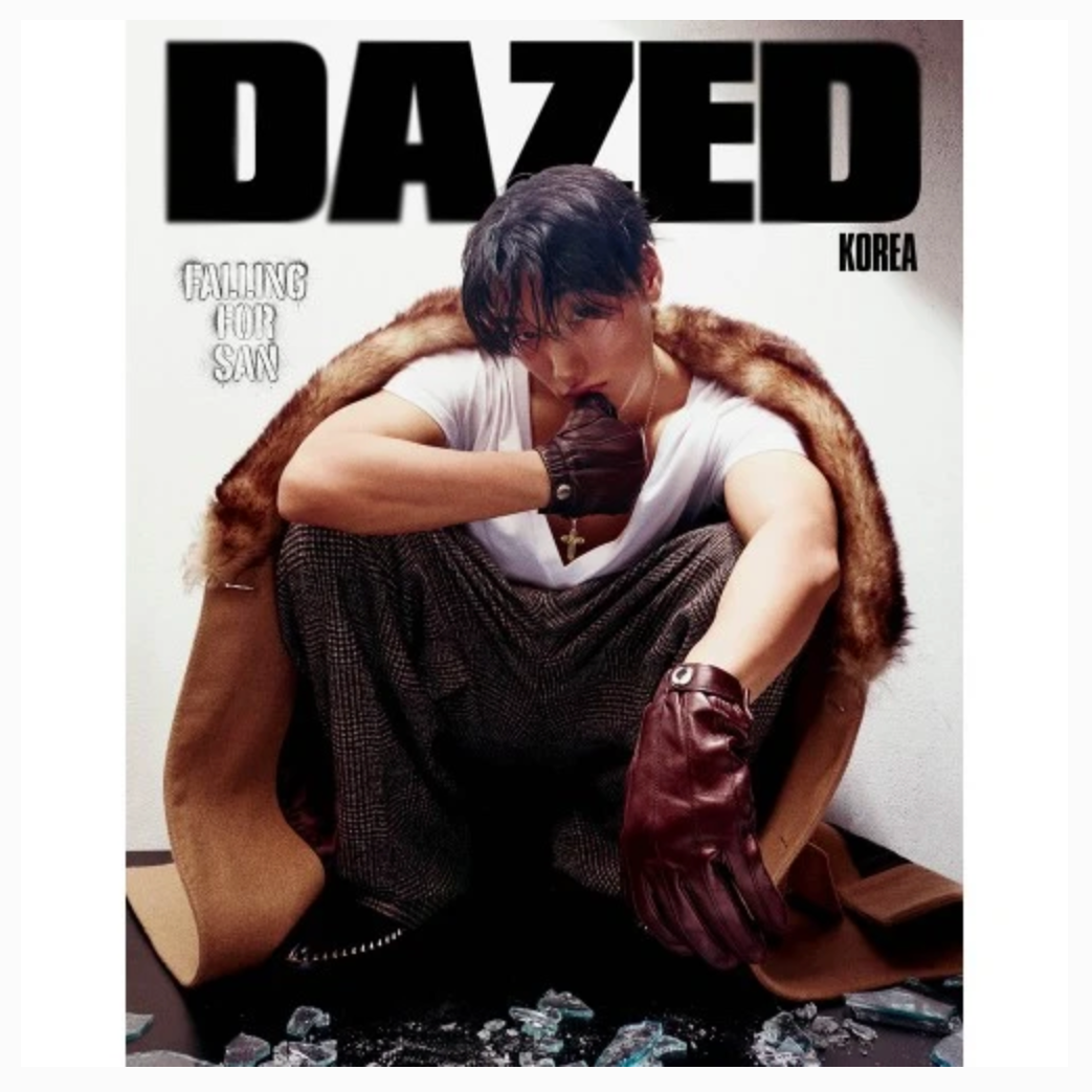 A magazine cover featuring a seated male model wearing a white tank top, dark textured pants, brown leather gloves, and a brown fur-trimmed coat, with large 'DAZED KOREA' masthead text at the top.