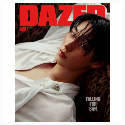 A magazine-style cover featuring a person reclining in a white draped garment against a leopard-print surface, with large red 'DAZER' text at the top and smaller white text reading 'FALLING FOR SAN'.