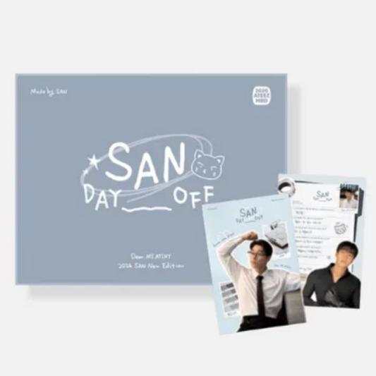 A boxed collectible item labeled 'SAN DAY OFF' with printed photos and cards arranged in front on a light gray background. The box is pale blue-gray with white handwritten-style text and graphics, and the cards show a man in a white shirt and black tie, plus other printed inserts.