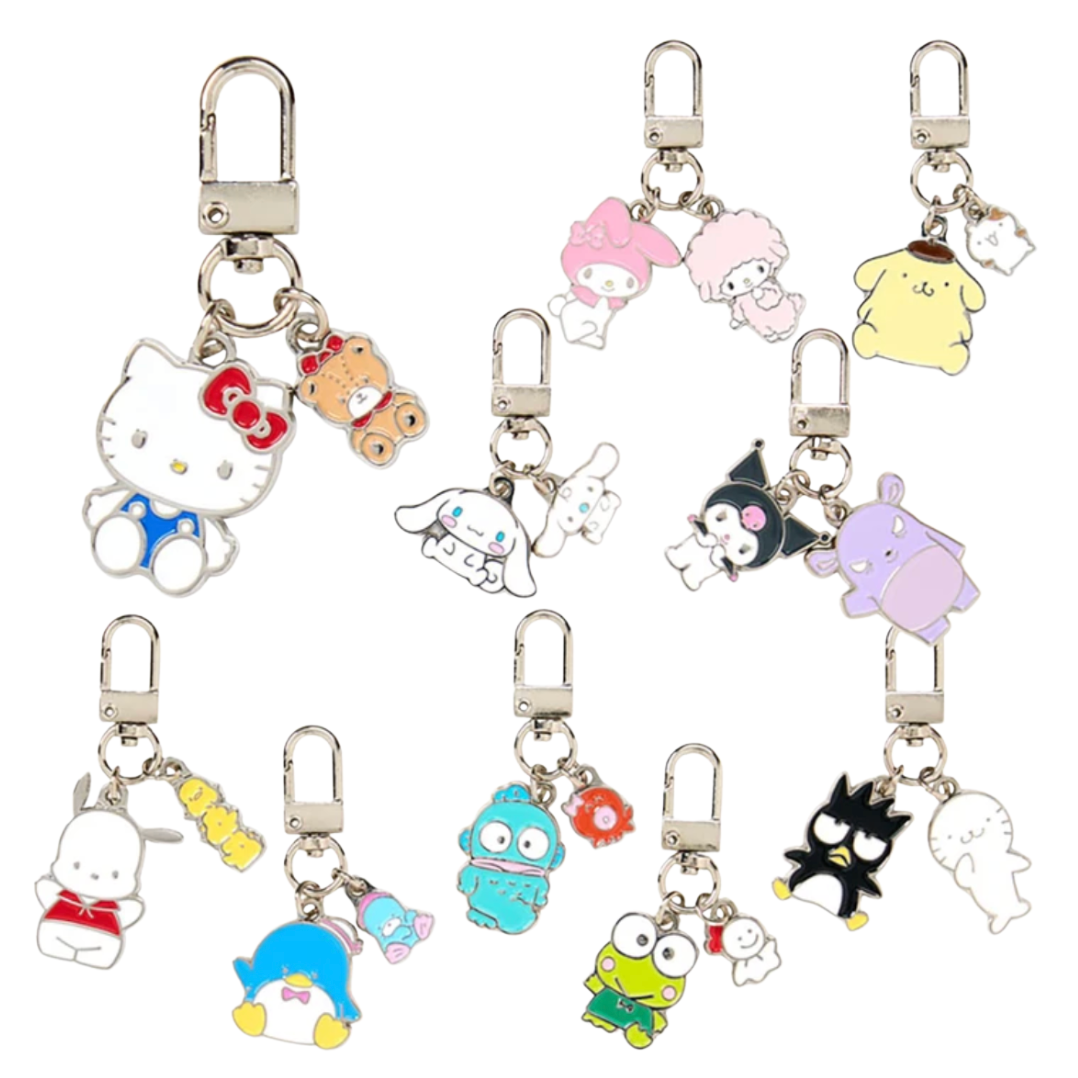 A set of ten Sanrio character keychains with silver lobster clasps, arranged on a plain white background. The characters include Hello Kitty, Cinnamoroll, Pompompurin, Kuromi, My Melody, Sanrio, and other Sanrio characters in various colors.