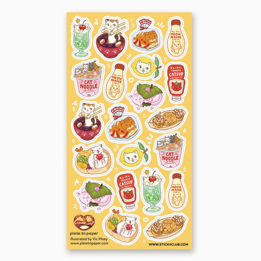 A sheet of cute cartoon food stickers featuring cats eating ramen, sushi, tacos, and drinks on a pale yellow background, photographed against a light gray backdrop.