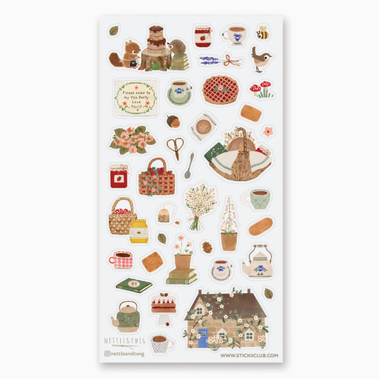 A sheet of whimsical autumn-themed stickers featuring illustrations of a cozy cottage, tea cups, baskets, flowers, and small animals on a white background.