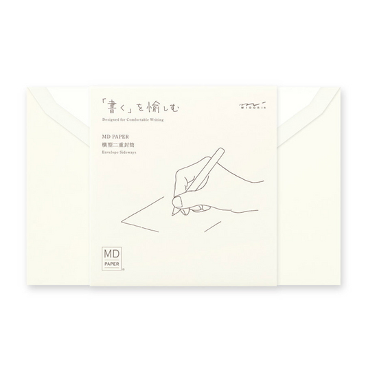 An off-white MD Paper envelope with a printed line drawing of a hand writing, shown with two matching envelopes behind it on a white background.