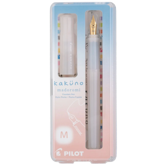 Pilot Kakuno Madoromi fountain pen set in a clear plastic case, featuring a translucent white pen with a gold nib and a matching cap, on a white background.