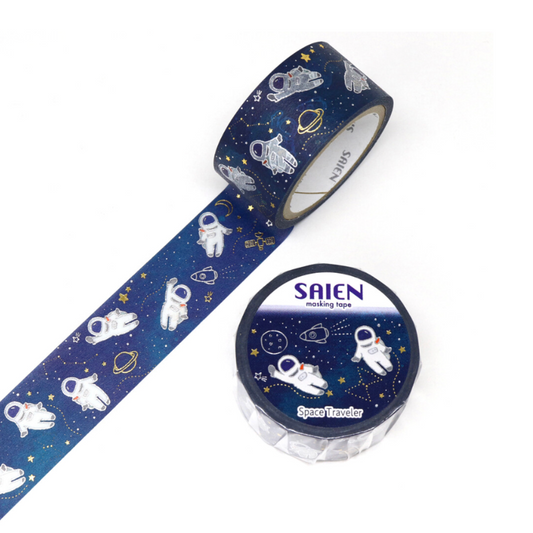 A roll of decorative washi tape and its spool, featuring a space theme with white astronauts, gold rings, and stars on a dark blue background. The brand name 'SAIEN' is visible on the spool.