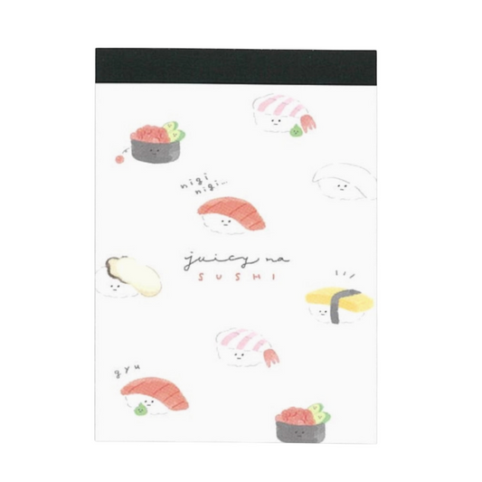 Memo pad with cartoon sushi design and text on a white background