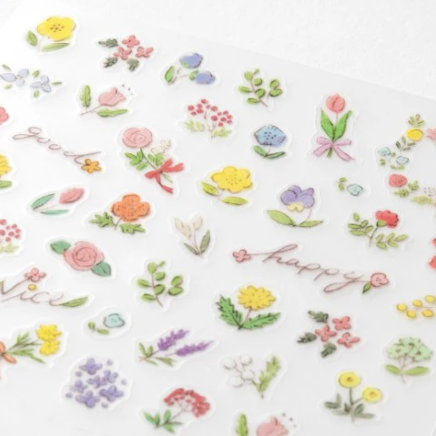Stickers with flowers and the words 'nice' and 'happy' on a white background