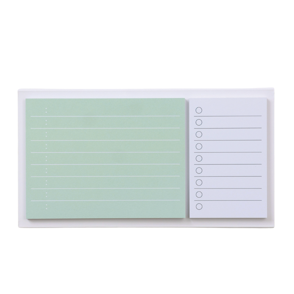 Two sticky note pads with different designs on a white background