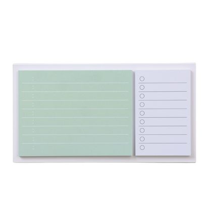 Two sticky note pads with different designs on a white background