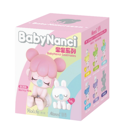 Box of Baby Nanci toys with cartoon characters on a white background