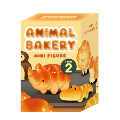 Box of Animal Bakery mini figures with rhino and crocodile designs on a beige background