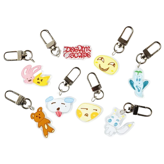 Collection of cartoon character keychains on a white background with 'Dreamscape' branding.