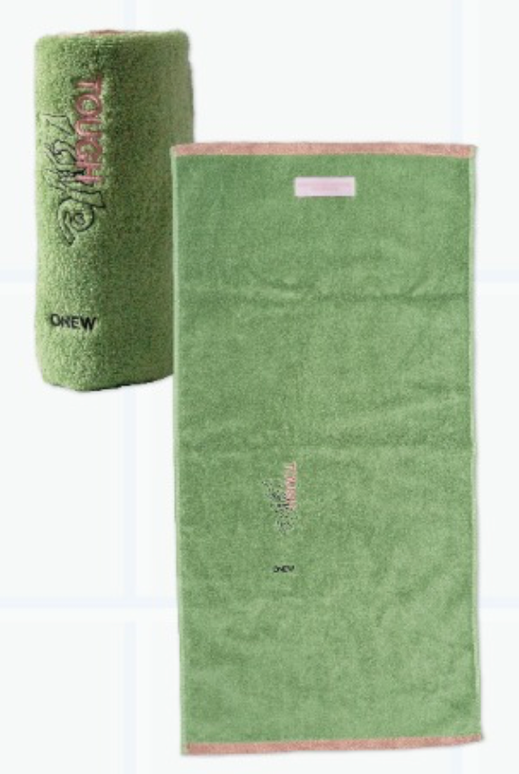 Green towel with brand logo on a white background