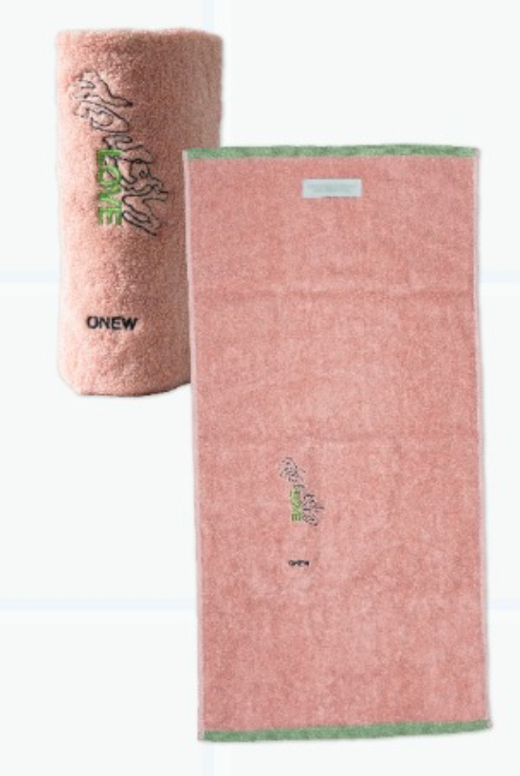 Pink towel set with green accents and branding on a white background
