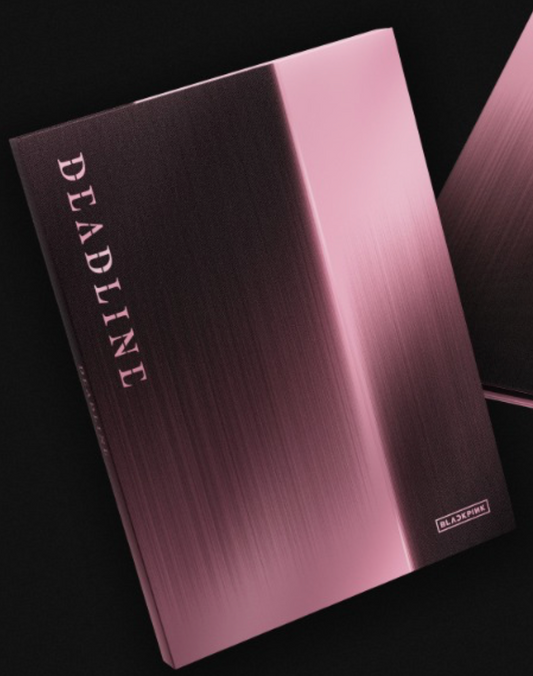 Metallic pink notebook with 'Deadline' branding on a black background