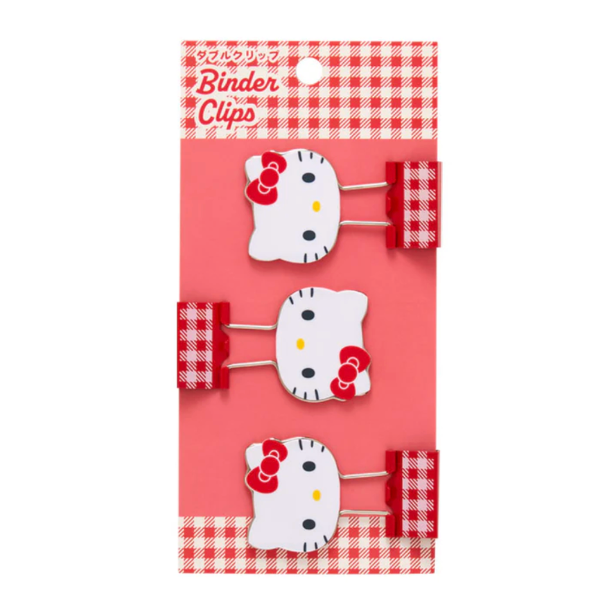 Set of three Hello Kitty-themed binder clips on a red and white checkered background