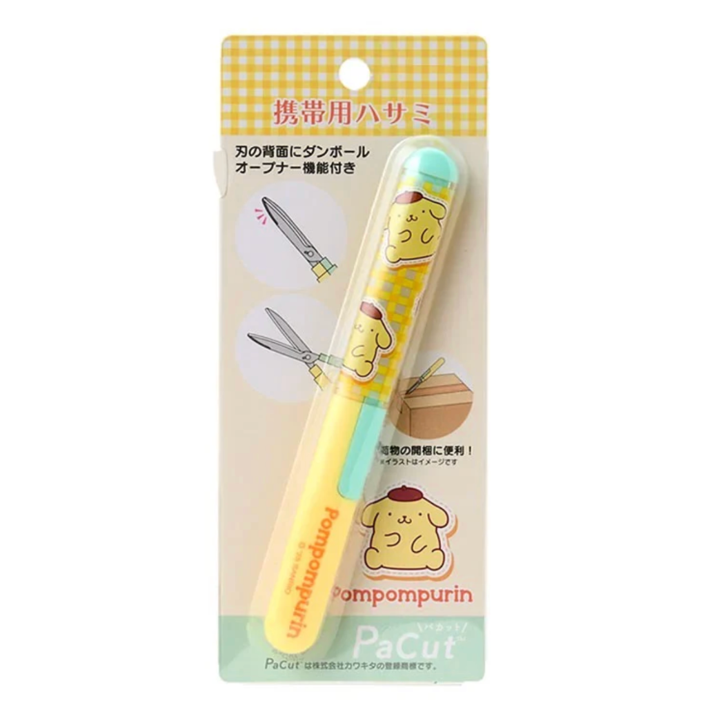 Small pair of scissors with a Pompompurin cartoon character on a yellow and white checkered background