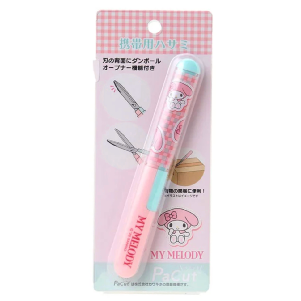 Pink and blue hair clip with My Melody cartoon character on a checkered background