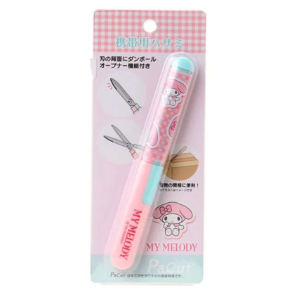 Pink and blue hair clip with My Melody cartoon character on a checkered background