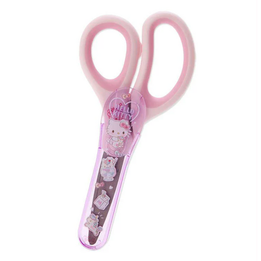 Pink children's scissors with Hello Kitty design on a white background