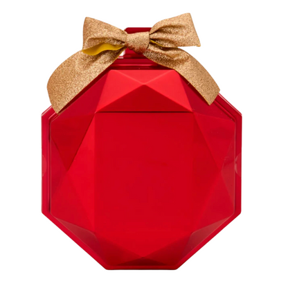 Red geometric-shaped container with a gold bow on a white background