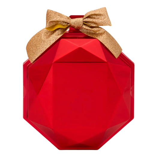 Red geometric-shaped container with a gold bow on a white background