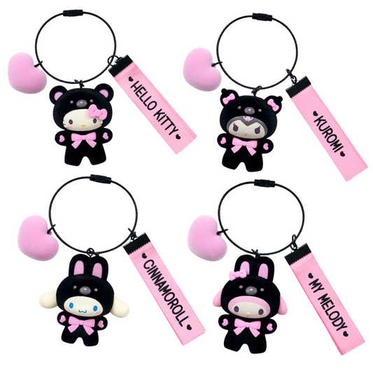 Four keychains with Sanrio characters and pink name tags on a white background