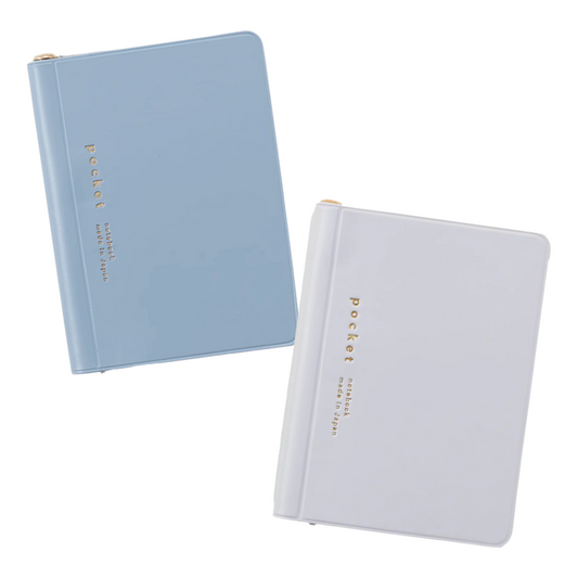 Two notebooks, one blue and one white, with 'pocket' text on a white background