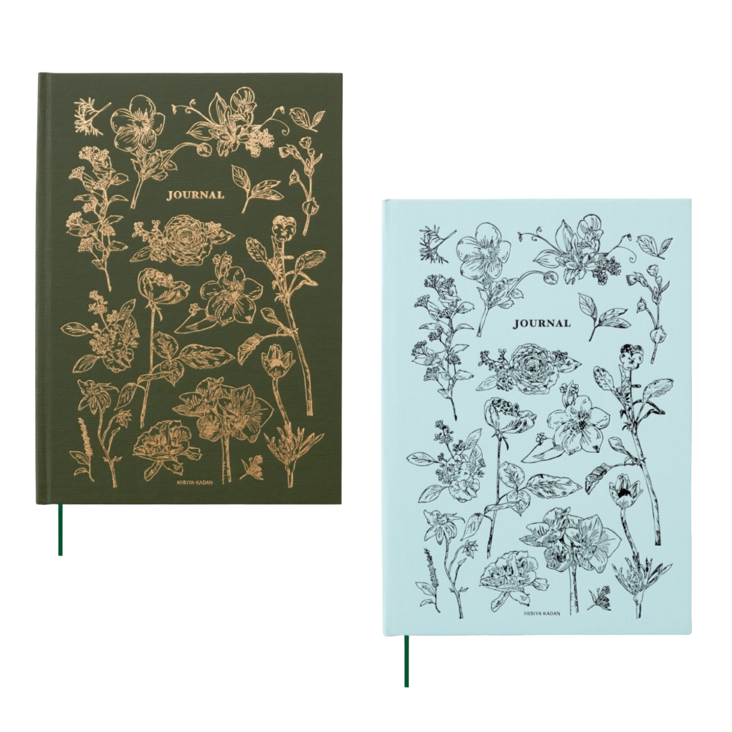 Two journals with floral designs on green and light blue backgrounds