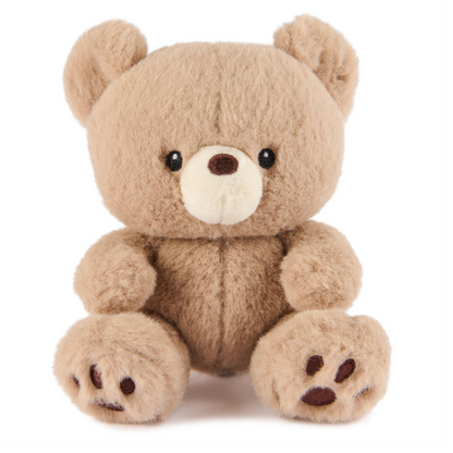 A plush teddy bear toy in light brown with a cream-colored snout and black eyes, sitting against a plain white background.