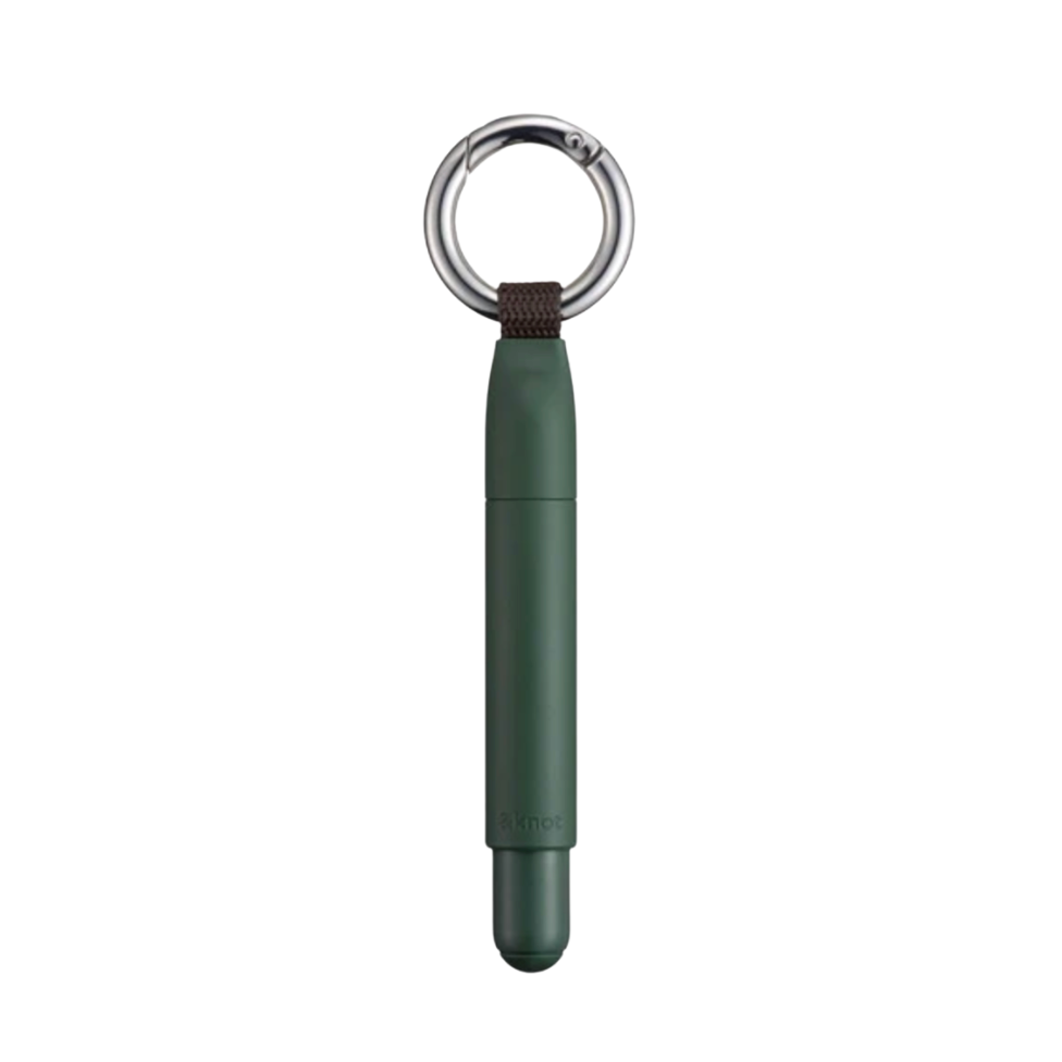 A dark green pen-style device with a silver metal key ring and a small dark brown loop, shown vertically on a plain white background.