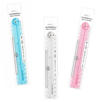 Three packaged multi-rulers in light blue, clear, and light pink, displayed vertically on a white background.