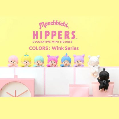 Monchhichi Hippers Decorative Mini Figures Colors: Wink Series, featuring a lineup of eight small character figures in pastel colors against a bright yellow background with pink text.