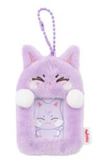 A purple plush cat-shaped phone case with a matching beaded strap, featuring embroidered closed eyes, pink inner ears, white paw pads, and a small visible 'Mamamoo' tag on the lower right.