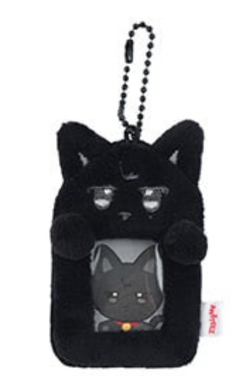 A black plush cat-shaped phone pouch with a ball chain strap, featuring a cartoon cat face on the front and a small red tag on the side.