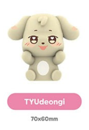 A cute cartoon dog-shaped product in a light beige color with a pink label below that reads 'TYUdeongi' and '70x60mm' on a white background.