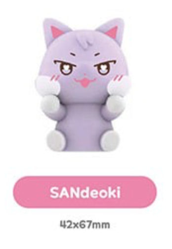 A cute lavender cartoon cat character toy or figurine with white paws and feet, pink inner ears, and a pink mouth, shown on a white background above a pink label reading SANdeoki and size 42x67mm.