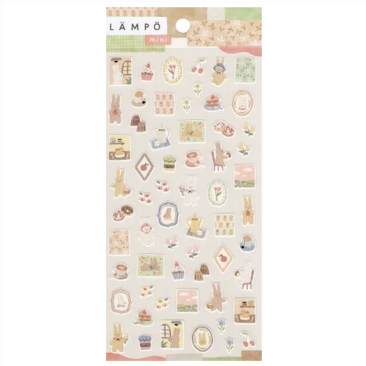 A sheet of Lämpó pastel stickers featuring cute bunny, cupcake, clock, and tea-time illustrations on a cream background.