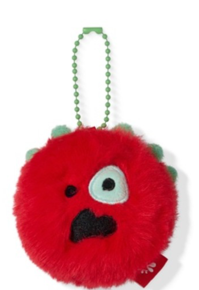 A red fuzzy monster keychain pouch with a light green beaded strap, featuring a single large white eye with a black pupil, a black stitched mouth, and small light green spikes on the top.