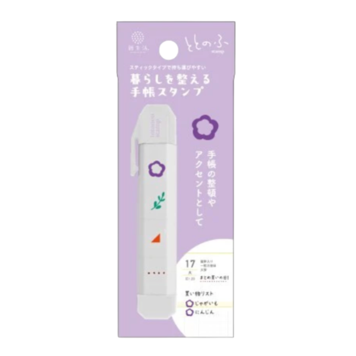 A Japanese handheld plastic stamp tool with small images and shown in its retail packaging, with a lavender card  on a plain white background.