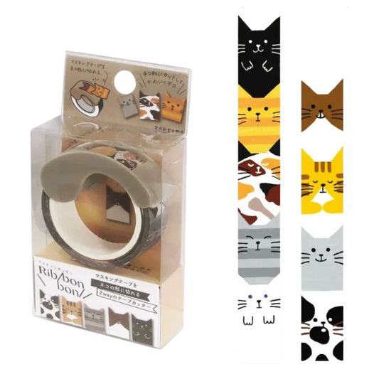 A roll of masking tape in its clear retail packaging, shown alongside two long strips displaying the cat-face pattern options. The tape features cute cartoon cat faces in black, yellow, brown, gray, and white on a white background.