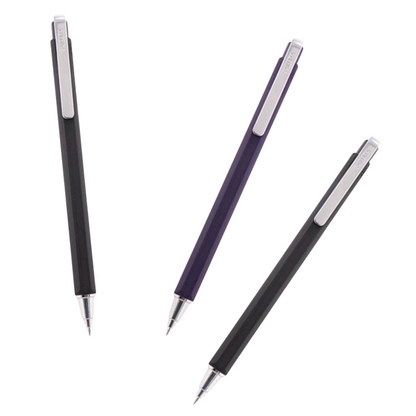 Three retractable ballpoint pens arranged diagonally on a plain white background: one black, one dark purple, and another black each with a silver clip and silver tip.