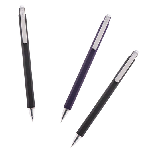 Three retractable ballpoint pens arranged diagonally on a plain white background: one black, one dark purple, and another black each with a silver clip and silver tip.